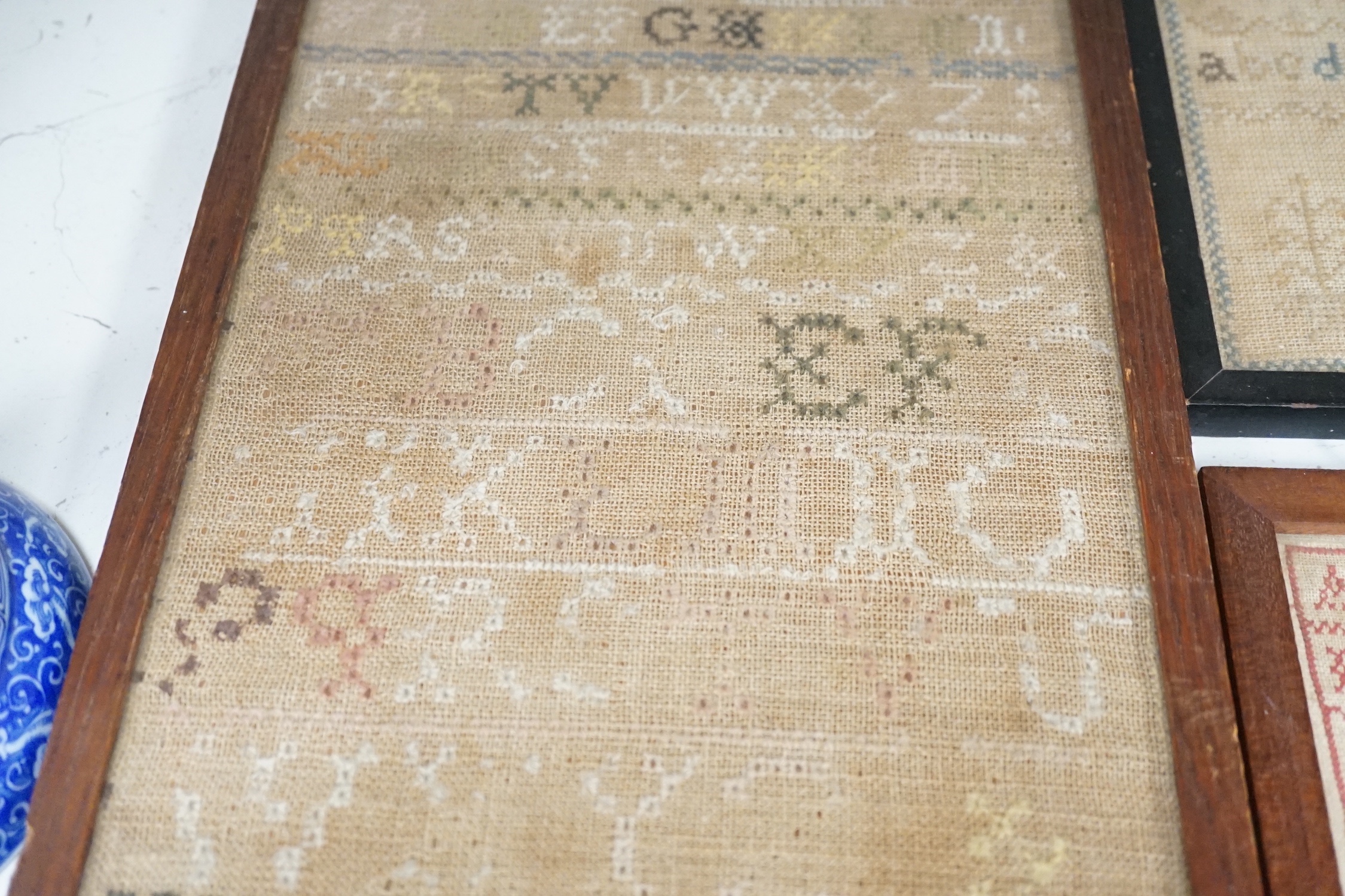 An unusual William IV ‘Register of birth’ small sampler together with four other samplers ranging in date from 1778 to 1851, largest 56 cm x 20.5 cm (5)
